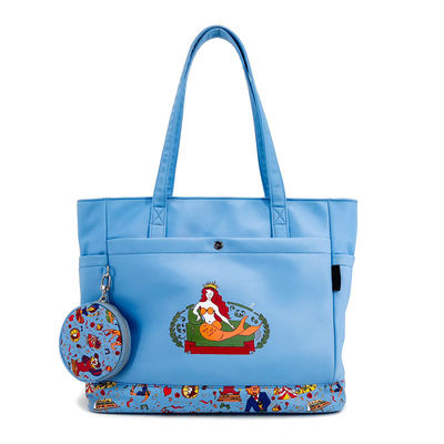 Un sac à main en toile, un sac à fente, un sac à imprimer en numérique, un sac bleu avec une poche à pièces.