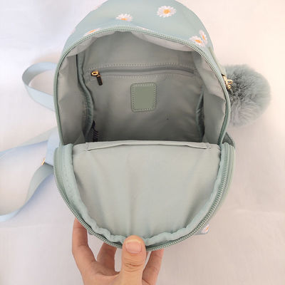 Petit sac à dos bleu à la mode avec fermeture à glissière