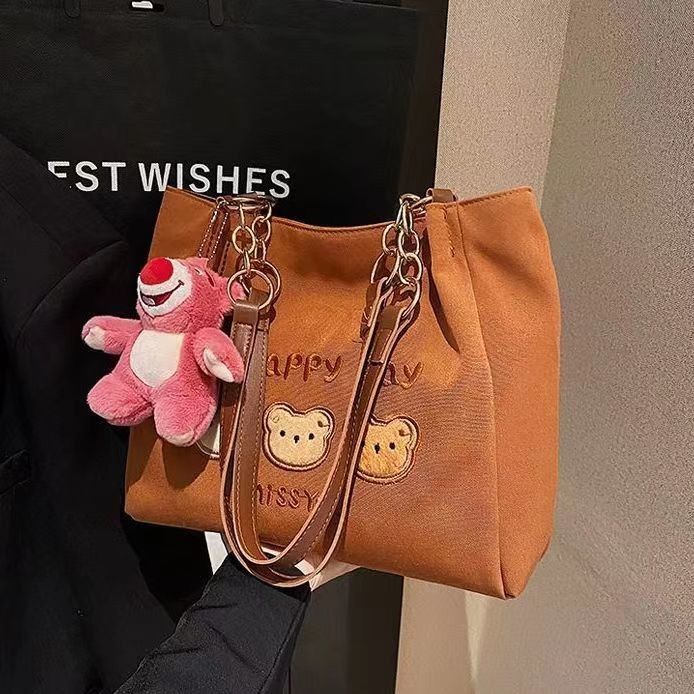 Sac à dos à corps croisé de taille moyenne et élégant de couleur brune avec poignées doubles